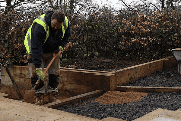 ashby facilities employee working on garden site for local authority